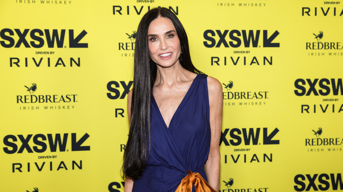 Demi Moore's Saint Laurent Dress Stuns with Extreme Slit and Bow Details