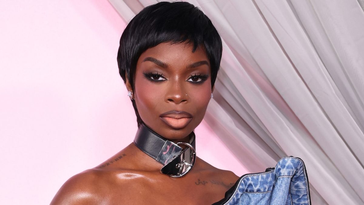 Olandria Carthen Channels Iconic 1959 Barbie with Striped Swimsuit and Ponytail