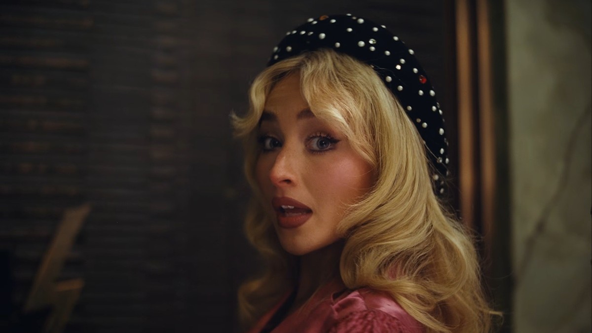 Sabrina Carpenter Rocks Pink Bikini with a Lacy Surprise in New Music Video!