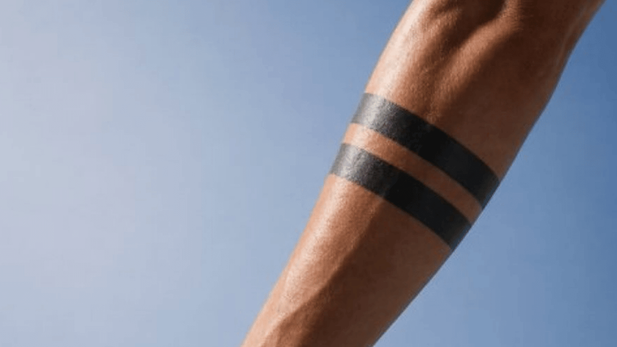 Black band tattoos can signify mourning—or carry an explicit sexual meaning