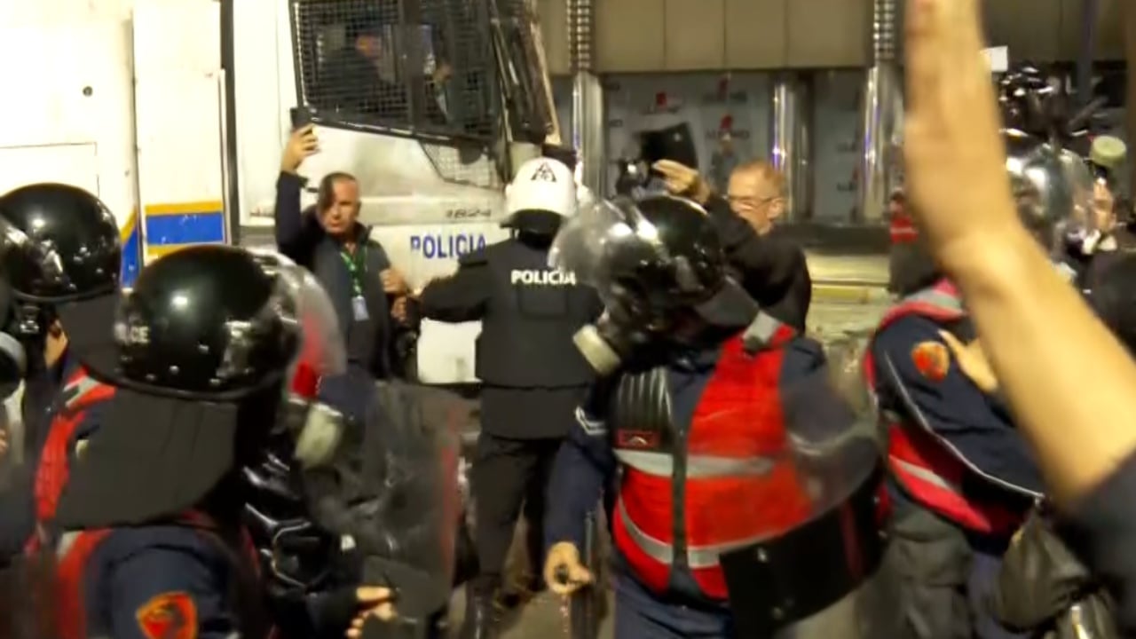 Protesters Raise Hands Against Police Water Cannons in Front of Prime Minister's Office