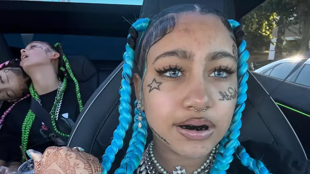 North West gives a harsh response to a fan who criticized her for having 'face tattoos and piercings'.